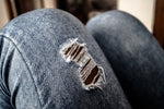 How Distressed Jeans Became a Staple in Women's Wardrobes - THE AMERICAN BLUE
